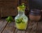 Fresh healthy Jito or mojito soda juice with raw fruit served in jar isolated on wooden table side view