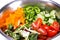 Fresh, healthy, organic ingredients for making vegetable salad. Tomatoes, cucumbers, green and yellow peppers, mixed green salad,