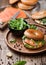 Fresh healthy organic sandwich with bagel and salmon, cream cheese and wild rocket in bowl with bread and smoked salmon pack