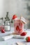 Fresh healthy strawberry smoothie in mason jar with garnish on gray background. Summer dessert. Milkshake with banana and berries