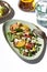 Fresh healthy summer seafood salad with spinach, avocado, oranges and feta cheese