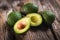 Fresh healty avocado on wooden background