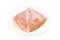 Fresh heart shaped skinless chicken breast meat on a plate