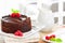 Fresh home made sticky chocolate fudge cake with raspberries