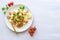 Fresh home-made tabouli, or tabbouleh salad, top view on grey concrete background with copy space