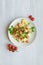 Fresh home-made tabouli, or tabbouleh salad, top view on grey concrete background with copy spaces