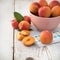 Fresh homegrown apricots on vintage white wooden tabl