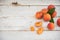 Fresh homegrown apricots on vintage white wooden table