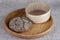 Fresh homemade bread made from durum wheat, rye, on a wooden tray with a sieve for flour.