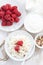 Fresh homemade cottage cheese with raspberry, milk and yogurt