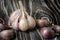 Fresh homemade garlic on a dark wooden background. Copy space for text or description