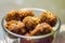 Fresh Homemade ladoo or laddu, made by bread crumbs with pistachio on it, with selective focus