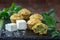 Fresh homemade muffins with cheese and nettle on wooden table