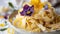 Fresh homemade pasta tagliatelle with edible flowers on a ceramic plate