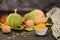 Fresh homemade vegan pumpkin puree or mash in small bowl, among autumn attributes:walnut, yellow leaves, pumpkin and pumpkins