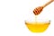 Fresh honey dripping from a spoon. On a white background.