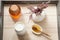 Fresh honey and milk served in white porcelain dishware on a wooden tray