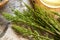 Fresh horsetail plant on a table with a cup of herbal tea