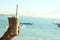 Fresh Ice Coffee Milk with blue beach background at day time. Holiday mood. Fresh drink in hand