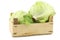 Fresh iceberg lettuce in a wooden crate