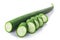 Fresh immature Luffa Luffa acutangula  pepo fruit, partially sliced, isolated w clipping paths