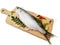 Fresh Indo-Pacific tarpon fish decorated with herbs and vegetables on a wooden pad,Selective focus.White background