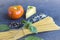 Fresh ingredients for cocking pasta with Traditiona Italian sauce Pesto. Dry Spaghetti, Basil leaves, tomato, parmesan on dark