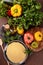 Fresh ingredients for tabbouleh salad: couscous, tomatoes, lemon, parsley, mint, olive oil, bell pepper.