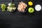 Fresh ingredients for tasty Waldorf prawn salad, with sauce apple and grape, on black wooden table , top view flat lay, with copy