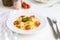 Fresh Italian pasta with cherry tomatoes, cheese and basil. Vegetarian spaghetti. Healthy food.