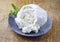 Fresh Italian ricotta with mint leaves on a modern design plate