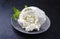 Fresh Italian ricotta with mint leaves on a modern design plate