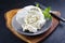 Fresh Italian ricotta with mint leaves on a modern design plate