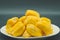 Fresh jackfruit slices on a white plate. sweet yellow jackfruit ripe. vegetarian, vegan, raw food. Exotic tropical fruit - isolate