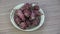 Fresh Jerusalem artichokes roots rotating in plate