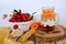 Fresh juice fruit and berry low-calorie mousse, dessert in glass with bubble tea, ripe apricots, cherry plums, pears, muesli bar,