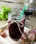 Fresh and juice grapes on wooden table