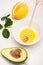 Fresh juicy avocado, lemon, bowl with