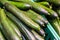 Fresh juicy green cucumbers on the supermarket counter. Cucumber background, ripe vegetables