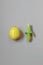 Fresh juicy Illuminating Yellow lemon on an Ultimate Gray background. Green spray nozzle for citrus fruits. Top view with copy spa