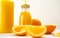 Fresh juicy orange slices and bottles with orange juice on a white background.