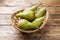 Fresh juicy Pears Conference in a basket on a wooden rustic background