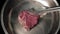 Fresh juicy piece of beef meat or pork meat is placed on a hot metal frying pan