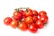 Fresh juicy red cherry tomato bunch closeup isolated on white background.