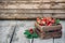 Fresh juicy strawberries with leaves. Rustic wooden box and handmade lace. Retro magazine picture. Strawberry with copy space