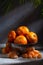 Fresh juicy tangerines with drops of water in a metal colander and peeled tangerine slices lie side by side on a light linen