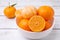 Fresh juicy tangerines on white wooden table, closeup