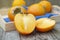 fresh khaki fruit , sliced in half, on rustic table. Healthy food