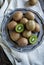 Fresh kiwis on vintage plate