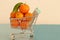 fresh kumquat orange fruit in supermarket shopping chart. healthy life style. plenty space for text. no person